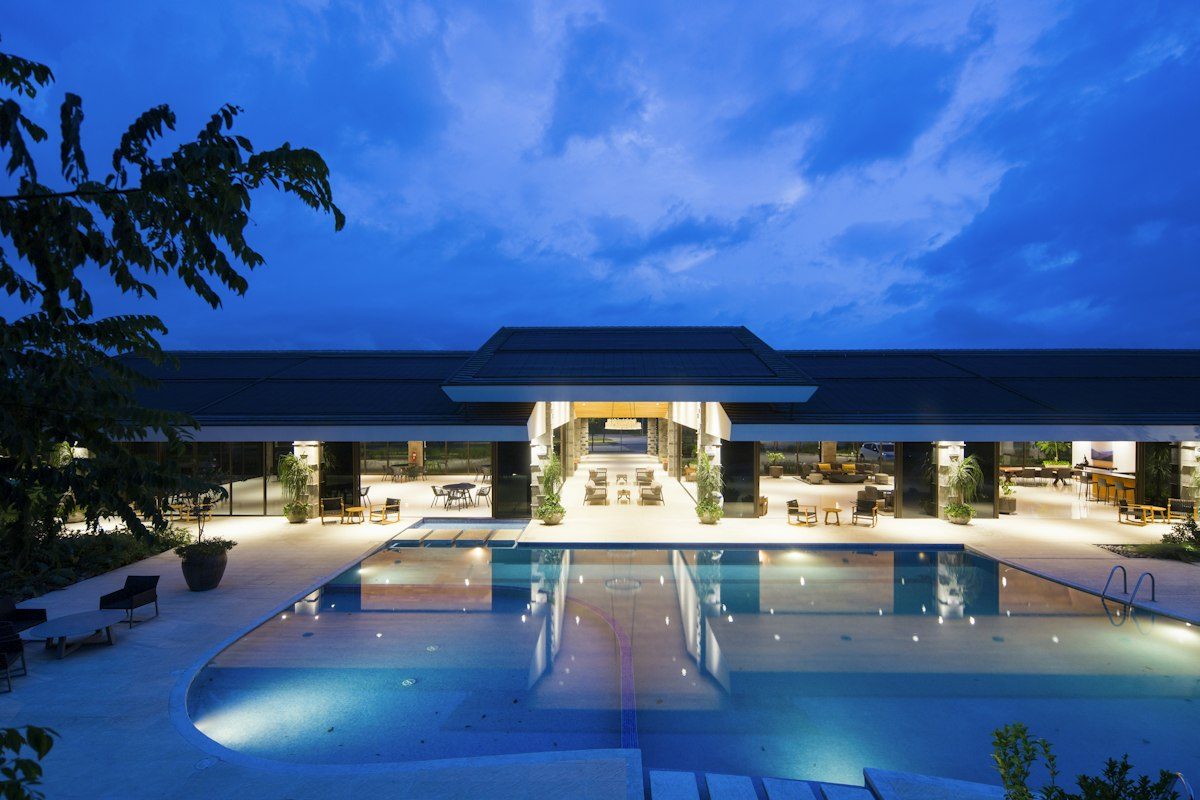 Resort hotel pool terrace at dusk